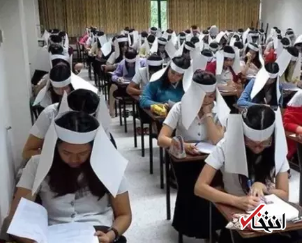 با عجیب ترین روش ضدتقلب در جهان آشنا شوید / قرار دادن جعبه مقوایی روی سر دانش آموزان